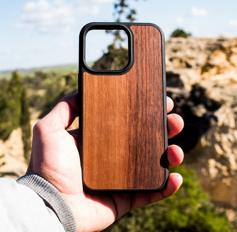Protect your iPhone 13 Series Wooden Phone Cases with our premium wooden phone case. Our cases are made from real wood and high-quality materials, providing first-class protection and a natural feel. The unique wood grain and color of each case makes it truly one-of-a-kind. The polycarbonate bumper provides maximum impact resistance, while the ultra-thin and lightweight design ensures a sleek and stylish look. With built-in buttons for volume and snap-on application, it's easy to install and use.