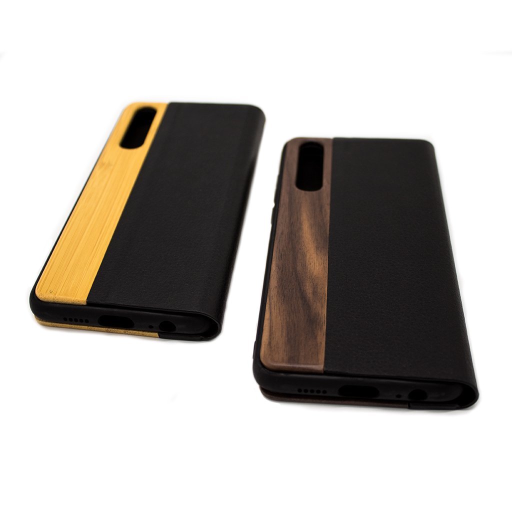 Protect your Huawei P20 Pro Wooden Flip Case with our premium wooden phone case. Our cases are made from real wood and high-quality materials, providing first-class protection and a natural feel. The unique wood grain and color of each case makes it truly one-of-a-kind. The polycarbonate bumper provides maximum impact resistance, while the ultra-thin and lightweight design ensures a sleek and stylish look. With built-in buttons for volume and snap-on application, it's easy to install and use.
