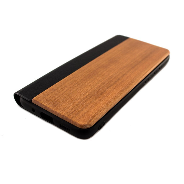 Protect your iPhone 6/7/8 Plus Wooden Flip Case with our premium wooden phone case. Our cases are made from real wood and high-quality materials, providing first-class protection and a natural feel. The unique wood grain and color of each case makes it truly one-of-a-kind. The polycarbonate bumper provides maximum impact resistance, while the ultra-thin and lightweight design ensures a sleek and stylish look. With built-in buttons for volume and snap-on application.